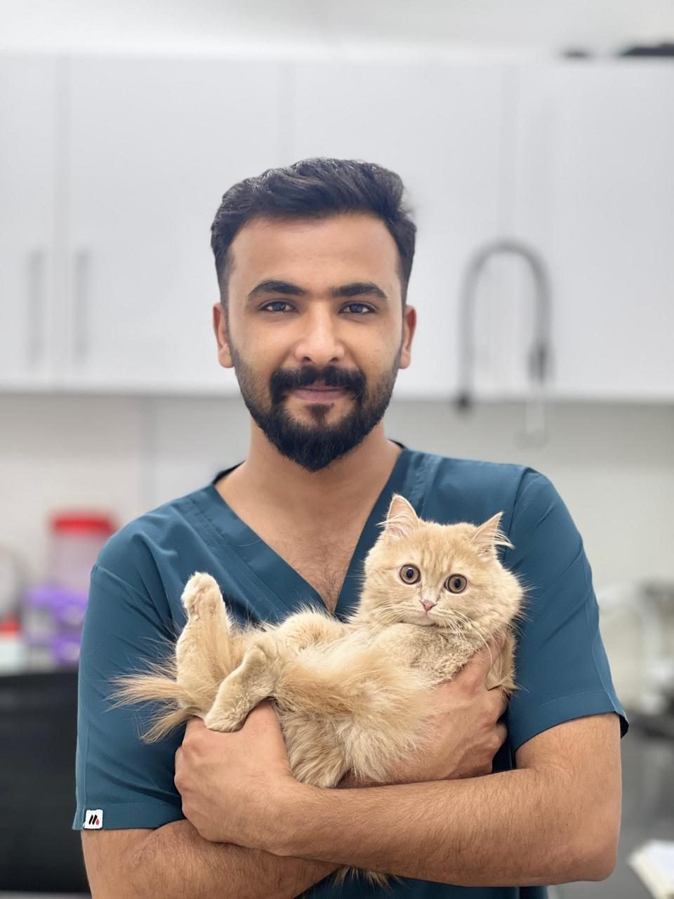 Vet holding a Persian cat at Pets Care N Cure, Vet & Animal Hospital in DHA Phase 6, Karachi